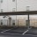 covered, outdoor parking next to apartments