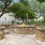 stone, outdoor fire pit surrounded by stone benches