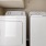side-by-side washer/dryer units in closet