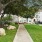 walkway leading to outdoor fire pit surrounded by beautiful landscaping