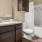 a bathroom with a tub sink and toilet