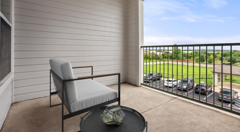 chair and table on private balcony with property views